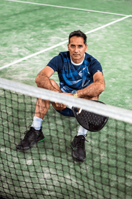 a padel player at an outdoor padel court