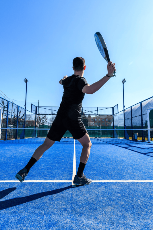 padel players playing in an outdoor court